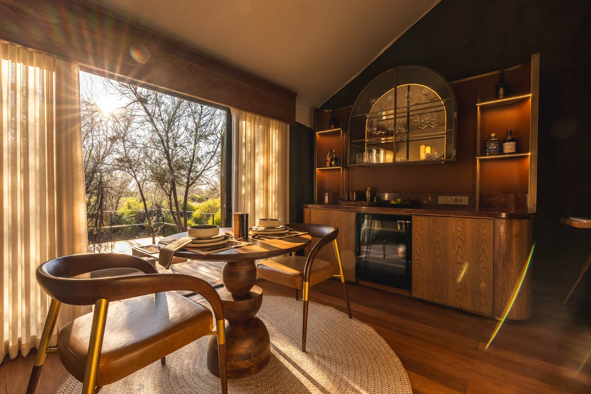 In-suite dining table with sunlight through the window