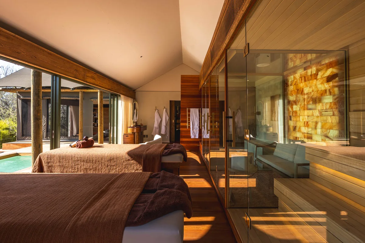The in-suite treatment room beside the glowing salt wall