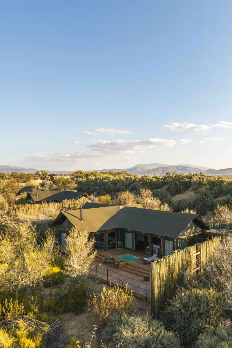 A suite set in the veld with mountains beyond