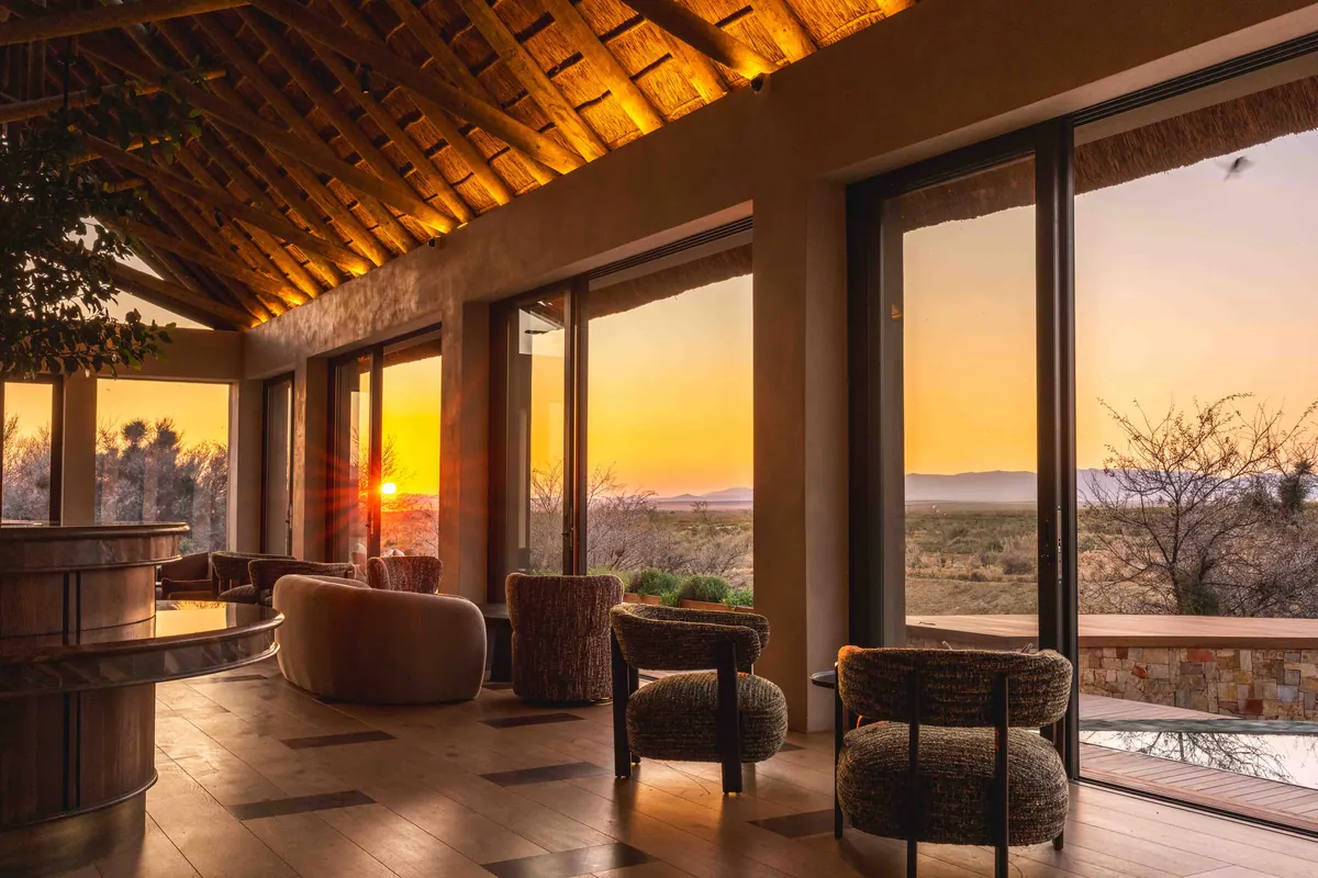 Lounge and dining space glowing with the setting sun