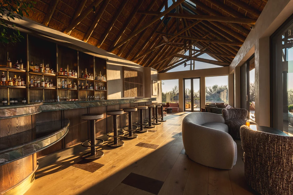 Long bar beneath a vaulted thatch roof