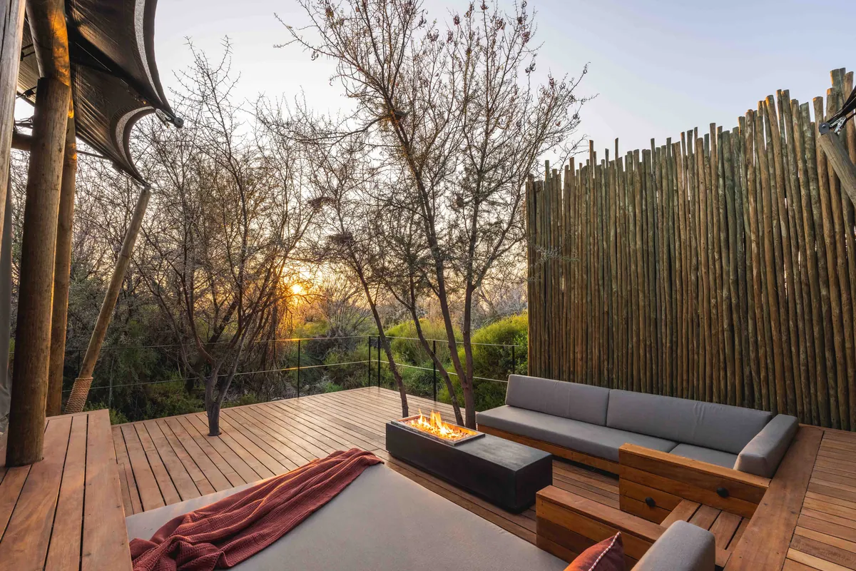 Outdoor daybed and fire pit on a private deck
