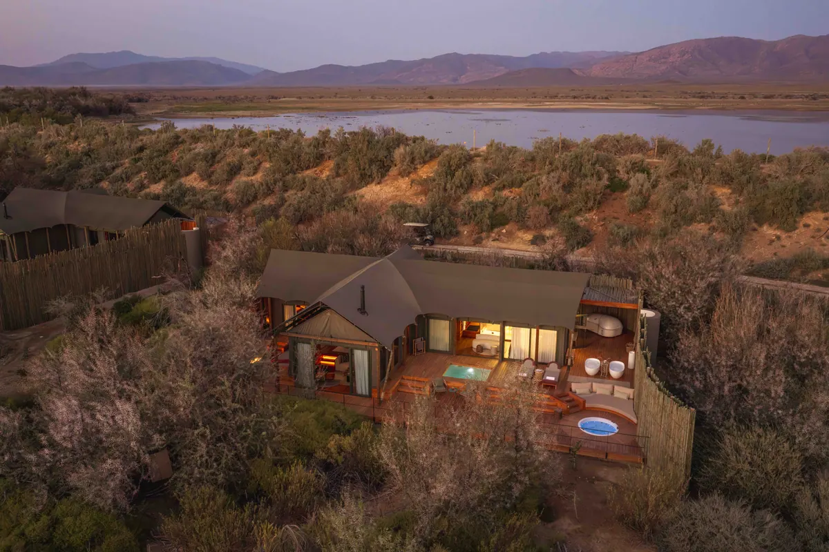 A private suite at dusk overlooking the watering hole